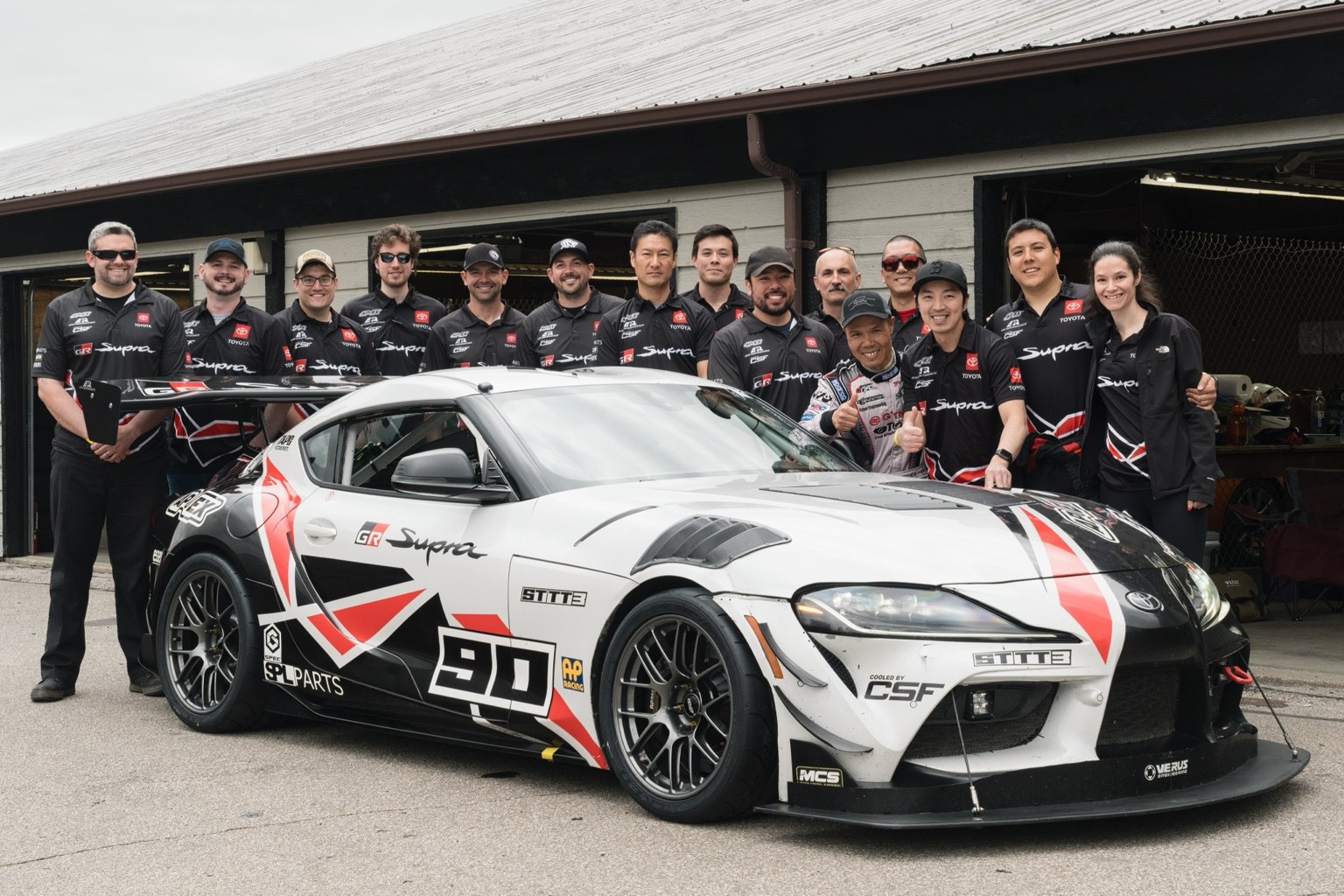 TAPG Motorsports team alongside its Toyota GR Supra